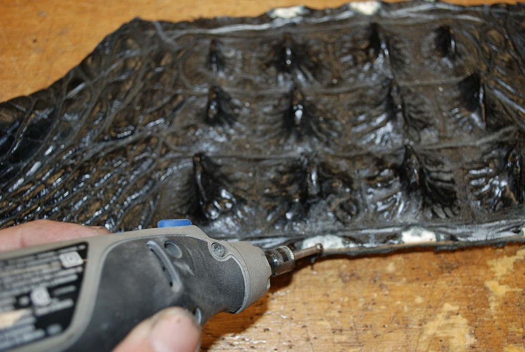Detailing a black hornback gator hide with a rotary tool