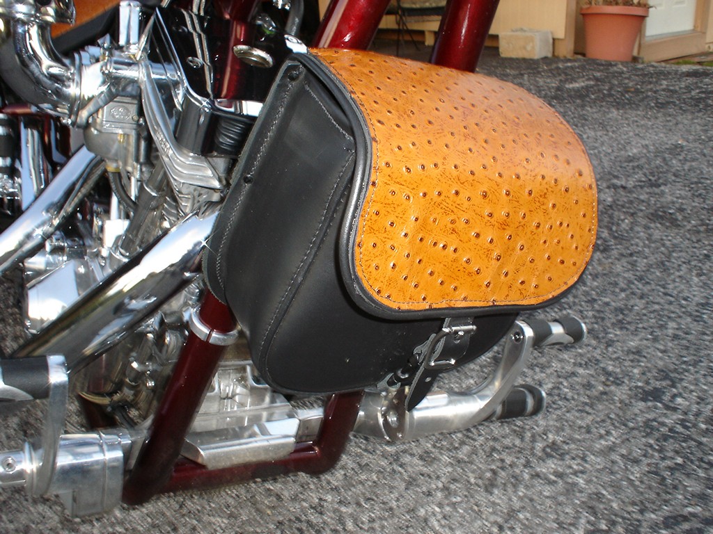Tool bag with a tan ostrich flap mounted on a bike
